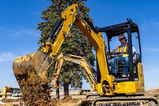 UW-Platteville student runs backhoe in lab