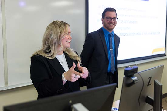 UW-Platteville marketing students are giving a group presentation in front of class.