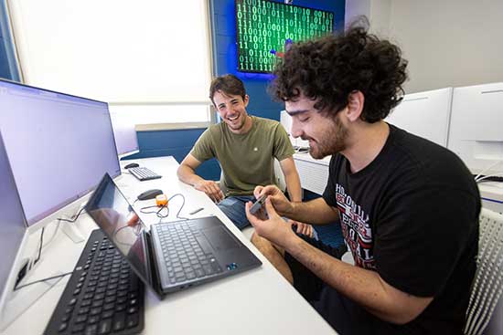 Two UW-Platteville computer science students collaborate on a project