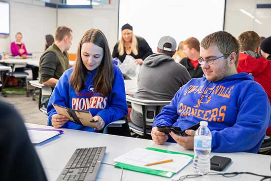 UW-Platteville students collaborate in small groups doing class.