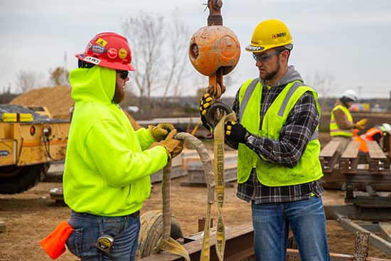 UW-Platteville students working with heavy construction equipment