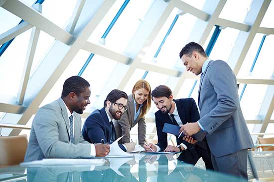 Group of business professional collaborate around a table