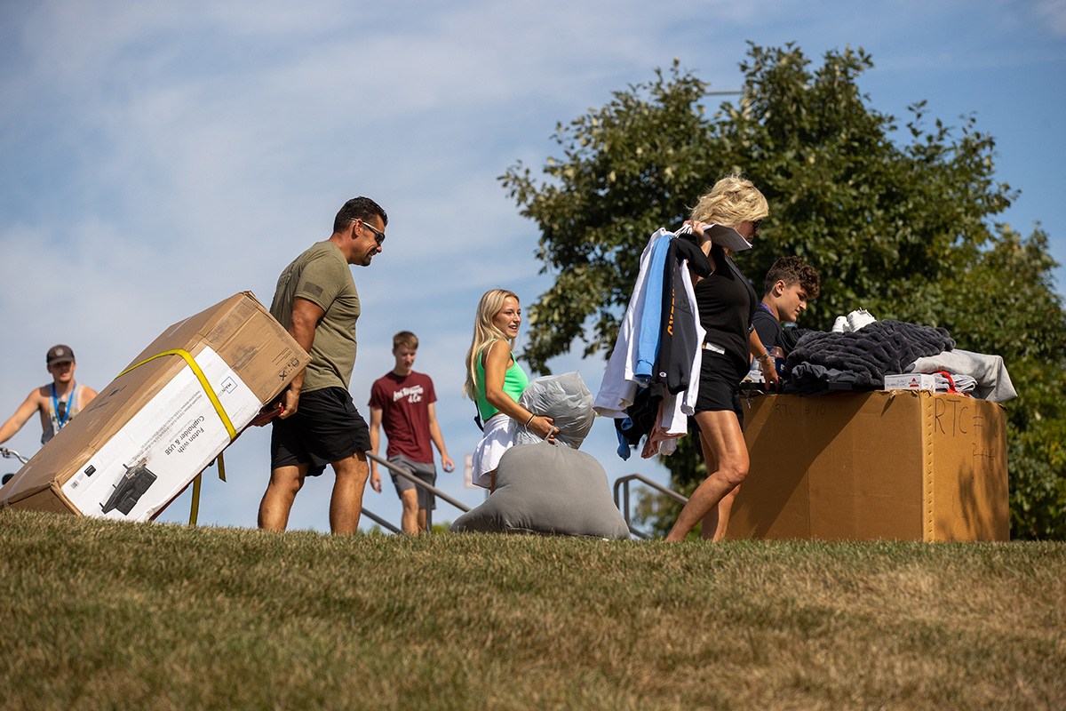 Student and family moving in to residence hall.