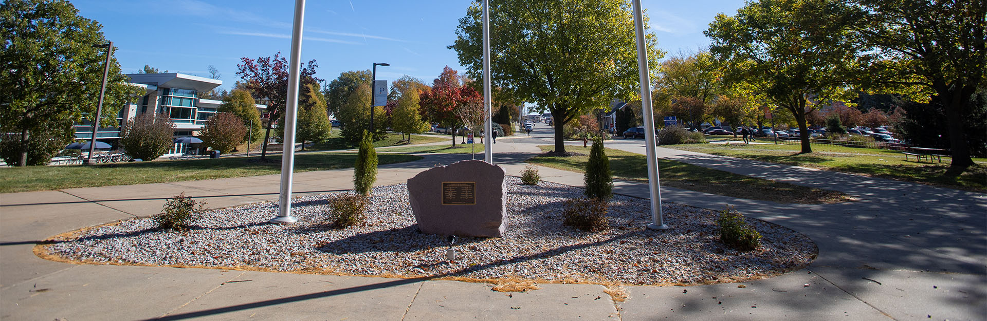 Vietname Veterans Memorial at base of 3 flag poles at UW-Platteville campus