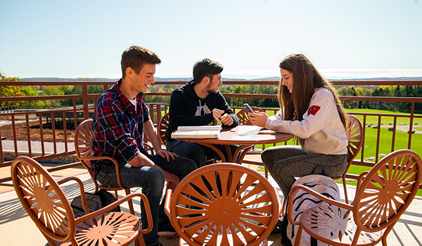 Baraboo campus students sitting outside