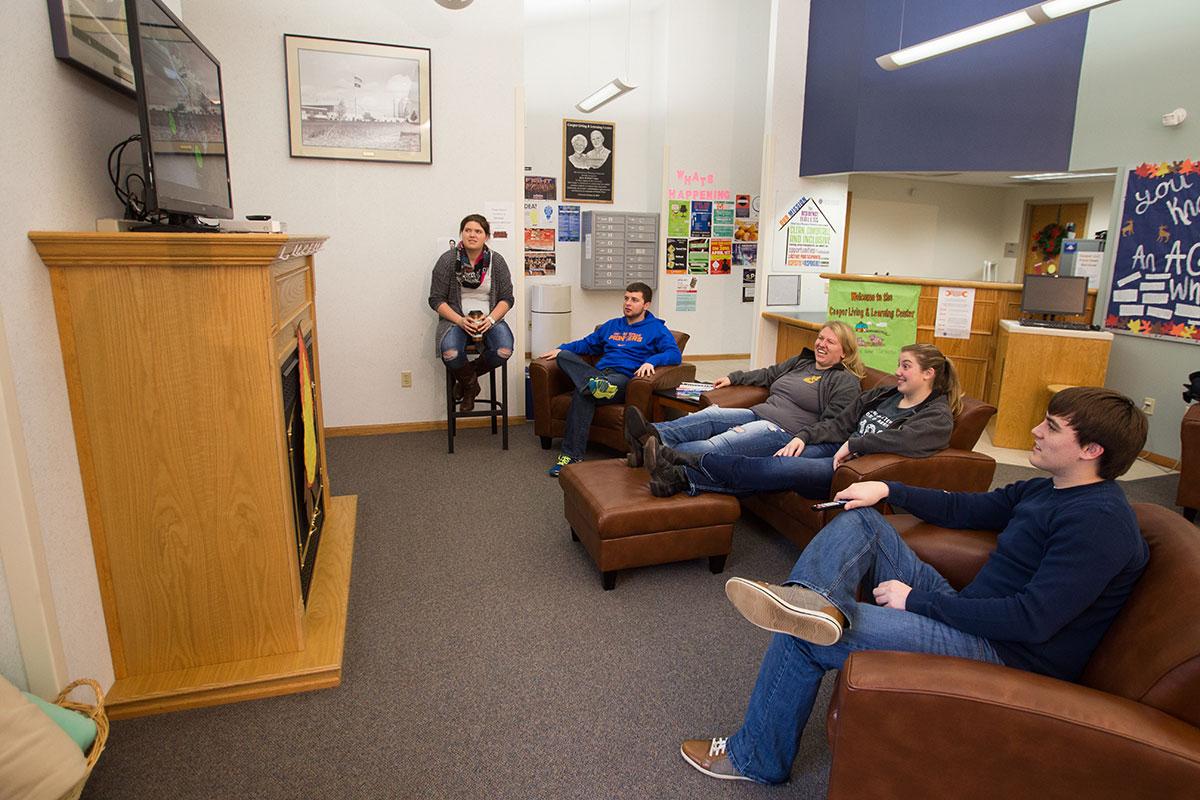Students in the living room lounge at Cooper Living and Learning Center