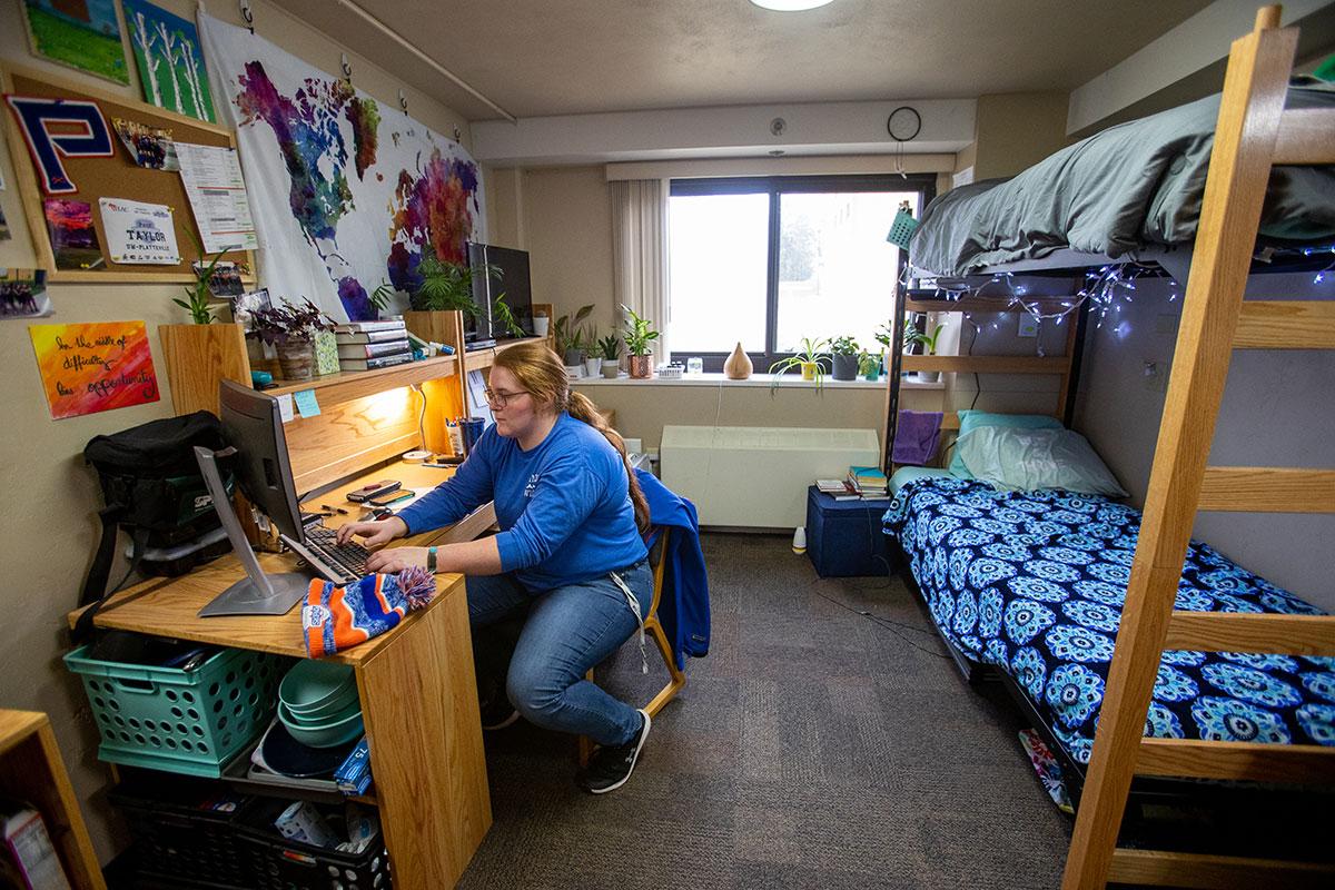 Student in room in Porter Hall