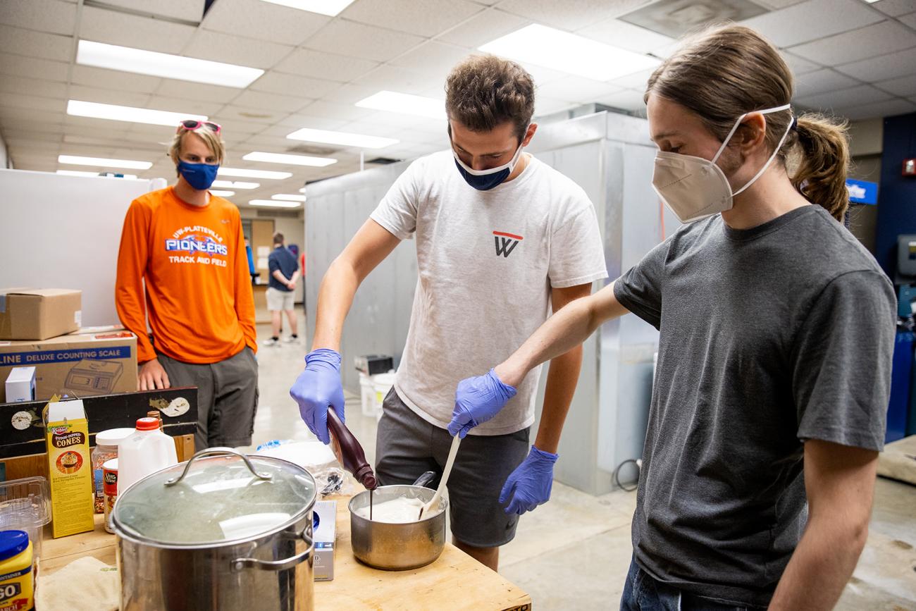 Student working with cow