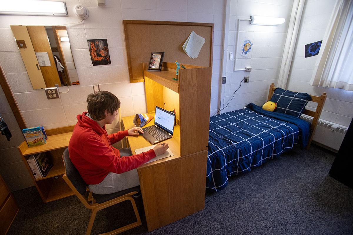 Student sitting in dorm room of Pickard