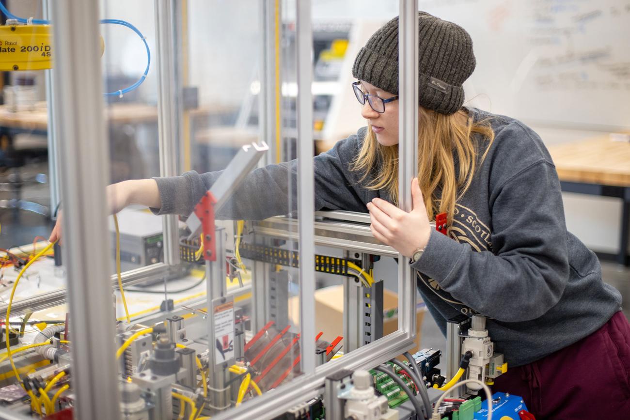 instructor and professor working with students in iiot testbed