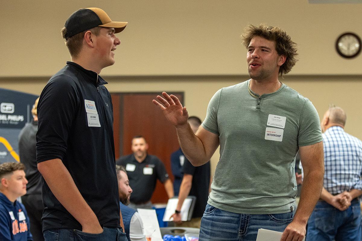 UW-Platteville student talking with employer from CG Schmidt at fall Construction Networking Event