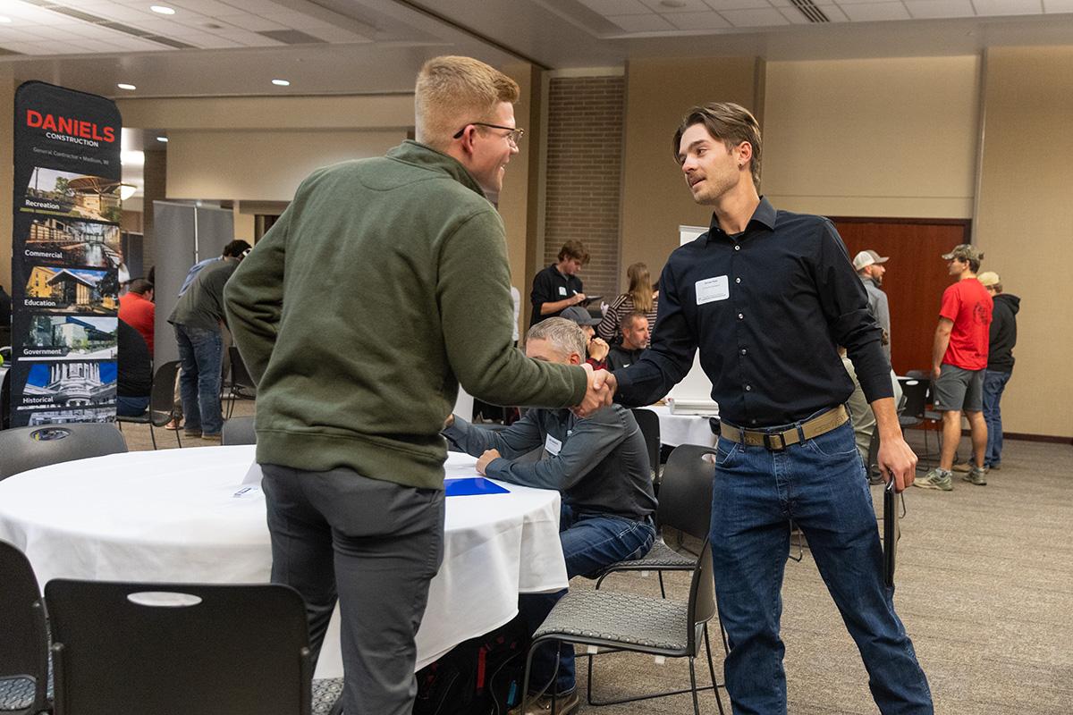 UW-Platteville student talking with employer from CG Schmidt at fall Construction Networking Event