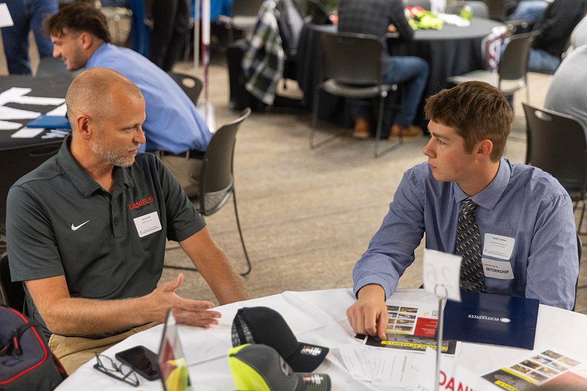 UW-Platteville student talking with employer from CG Schmidt at fall Construction Networking Event