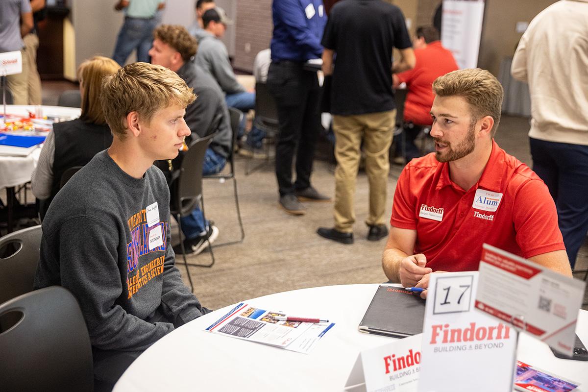 UW-Platteville student talking with employer from CG Schmidt at fall Construction Networking Event