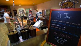 Interior photograph of UW-Platteville cafeteria with student ordering food