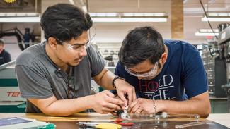 two students working in a lab