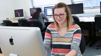 girl working at a computer