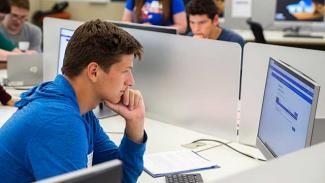 student working at a computer