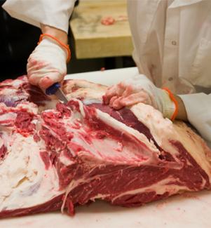 Chef chopping up meat
