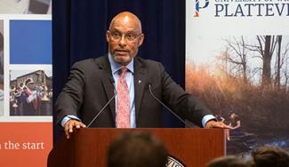 UW-Platteville chancellor giving a presentation at a podium