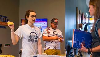 UW-Platteville desk assistant giving a student directions