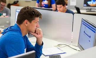 student working at a computer