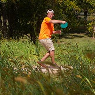 student playing frisbee