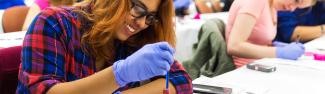 A forensic investigation student working with evidence