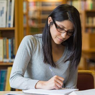 Woman filling out financial aid sheets