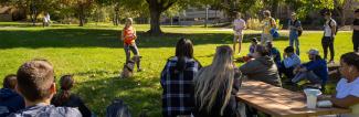 Psychology students in a general psychology class sitting outside.