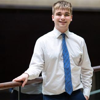 Mitchell Cotter poses for a picture in formal attire