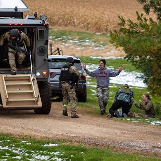 Criminal justice students doing drills with area SWAT team