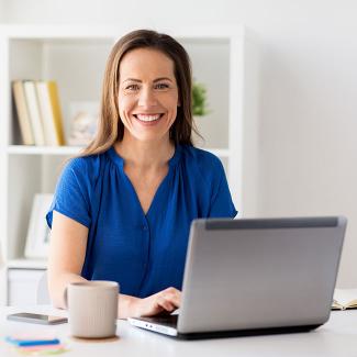 Student earning online degree in Human Resource Management on computer