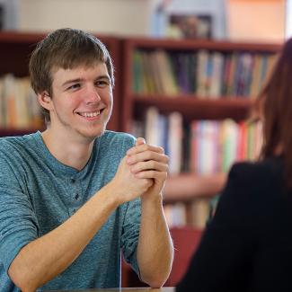 Baraboo student in library