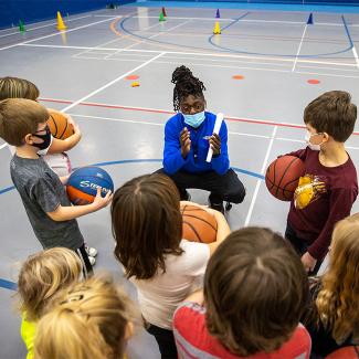 Student working with children