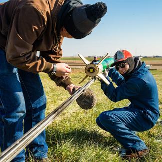 Students working on a rocket for the Pioneer Rocketry Club