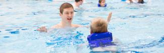 Student giving swimming instructions