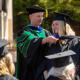 Dean Wayne Weber with graduate student at BILSA commencement