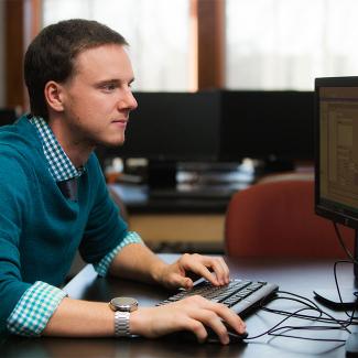 Computer science student working on computer