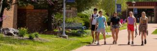 Baraboo sauk county students walking on campus in spring