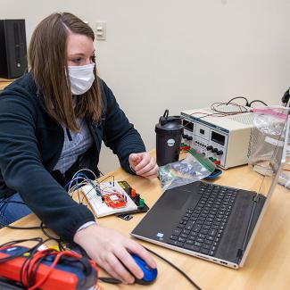 Student doing electrical work