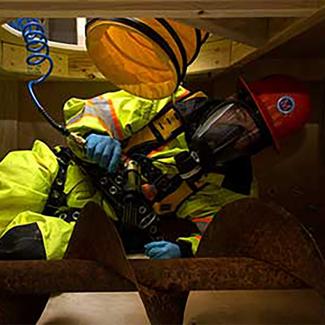 Student working with construction equipment