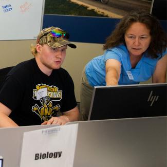 Biology students registering for scholarships