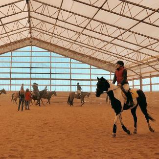 UW-Platteville Western Equestrian Team member riding a horse