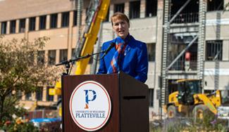 UW-Platteville chancellor giving a presentation at a podium