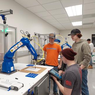 Student in robotics and controls lab