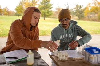Two students doing science