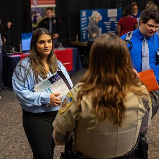 Students speaking to a criminal justice professional