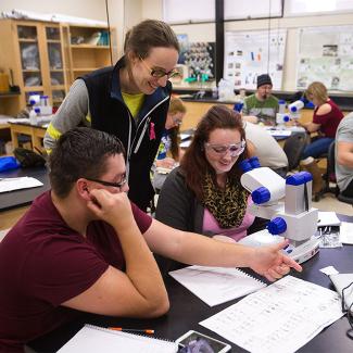 Students working with microscope