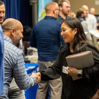 A student from UW-Platteville's accounting degree program networking at local event